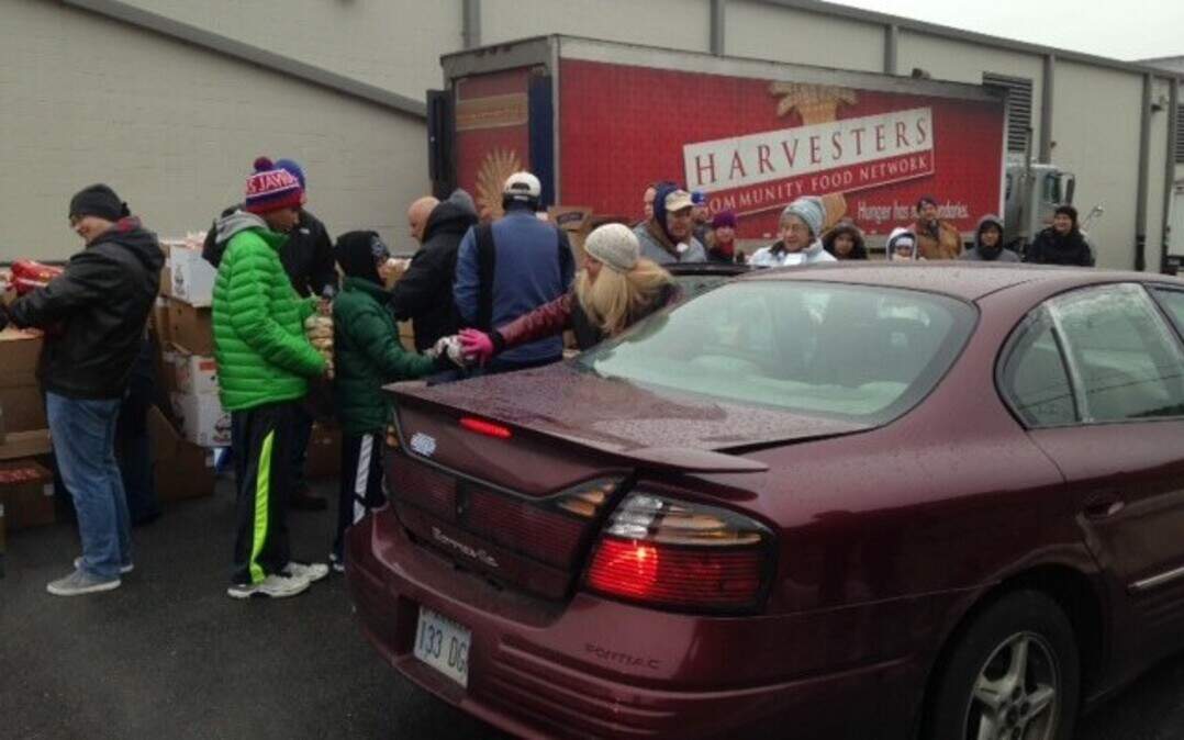
Paula Lehew (in white hat) was one of the volunteers distributing food Saturday at a mobile pantry at Kansas City Kansas Community College’s Technical Education Center, 6565 State Ave. The mobile pantry will return Dec. 13 and 20.
