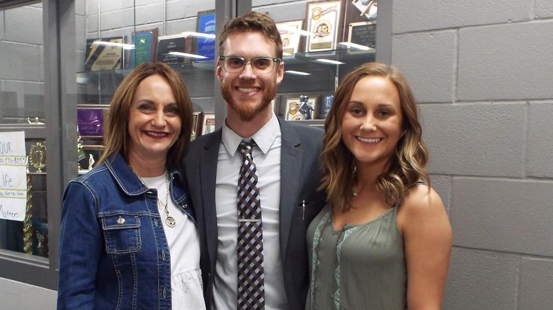 Teacher Brett Beneke (center) was nominated as Raymore-Peculiar’s Teacher of the Year by Kim McCauley (left) and her daughter, Kathryn, a junior at the high school.
