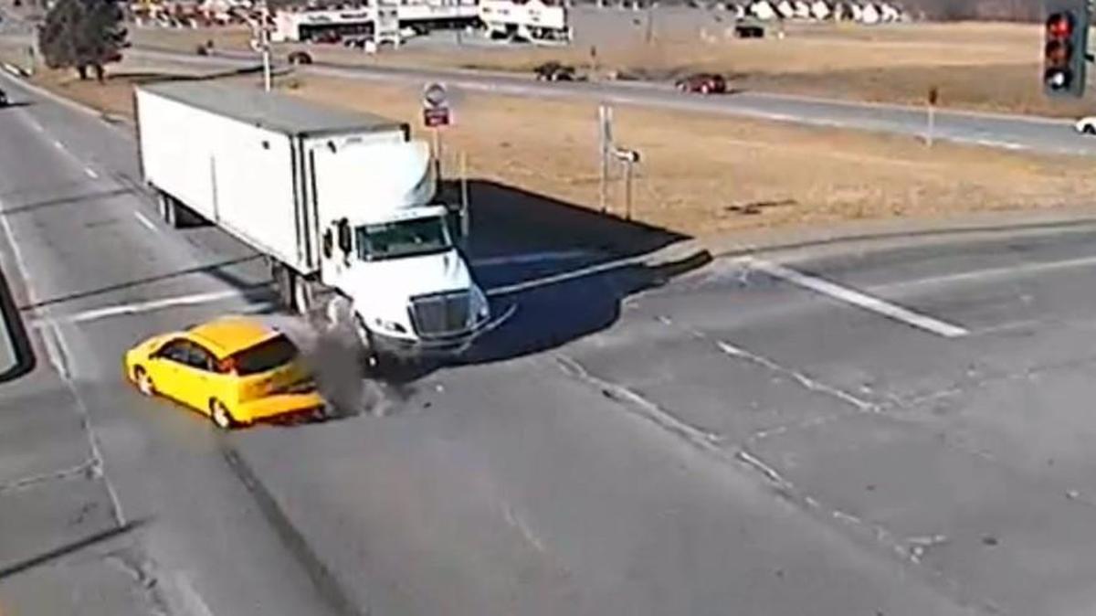 The Excelsior Springs police are using video of a collision with a semitrailer caught by a traffic camera as a warning to drivers to be wary of red lights runners.