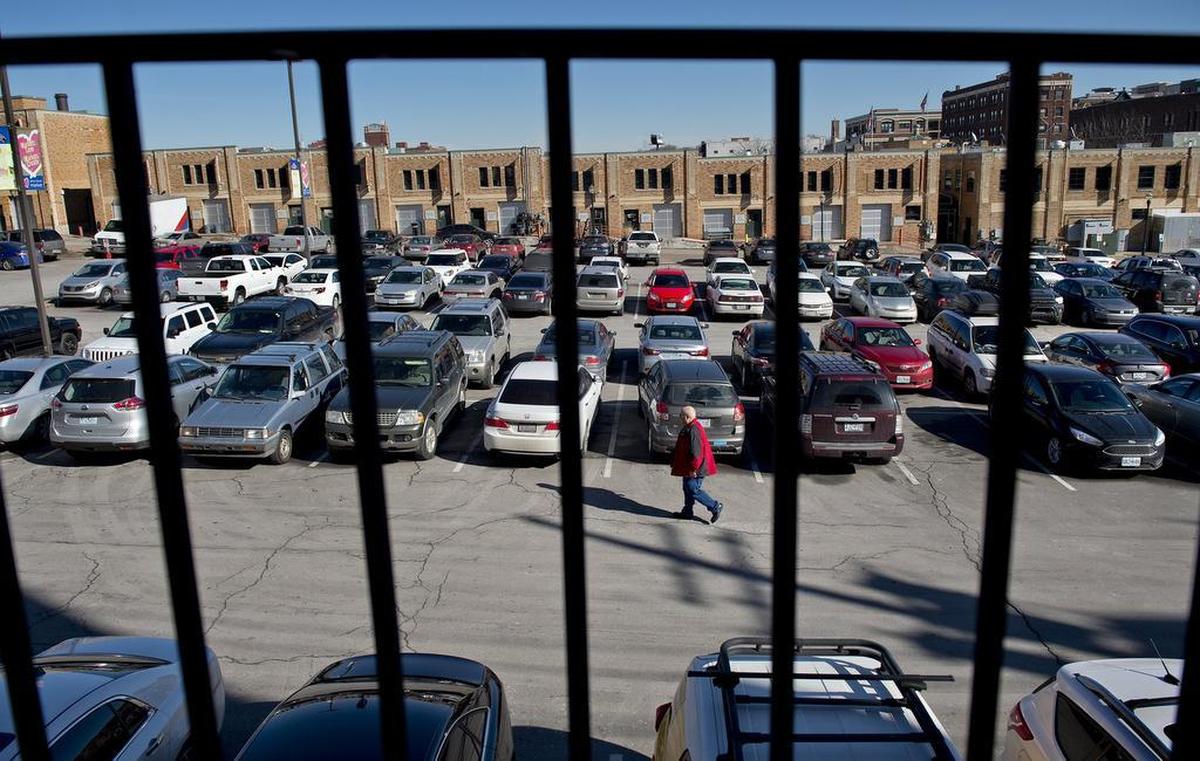 Although business was light in the City Market recently, free parking lots such as this one on the west side were filled with vehicles from downtown commuters, surrounding apartment dwellers and people working at or visiting other businesses in the area. Plans are to install parking meters in the City Market to help keep spots open for market customers.