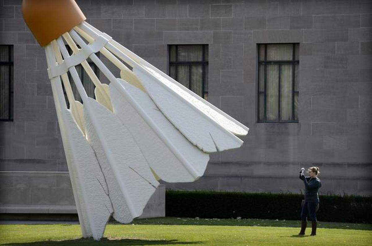Kristina Fulton of North Kansas City took time Monday to explore the grounds of the Nelson-Atkins Museum of Art, making photographs for a photography class she is taking at the Kansas City Art Institure. Fulton paused on the north lawn to make pictures of Shuttlecocks by Claes Oldenburg and Coojse van Bruggen, installed in 1994.