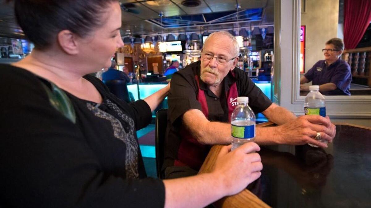 Michael Burnes, the owner of Missie B’s, was consoled by club entertainment director Jessica Dressler on Monday as they discussed the shooting in Orlando.