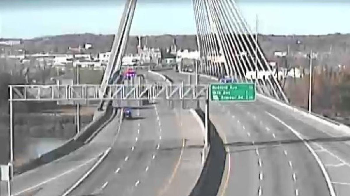 Police have closed both directions of Interstate 35 after a man allegedly threatened to jump from the Bond Bridge.