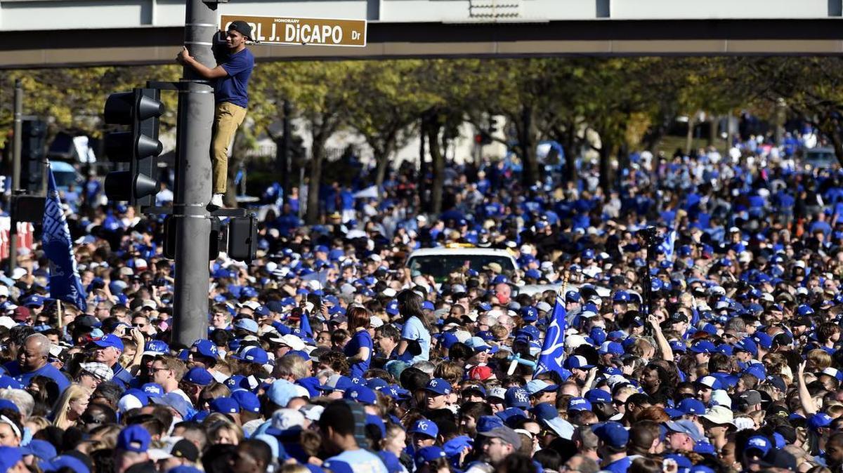 Crowds far exceeded the Kansas City Area Transportation Authority’s expectations. One fan, wanting a better view of the stage at Union Station, climbed a light pole and waited for the Royals to arrive Tuesday afternoon.