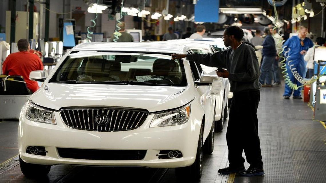 Cars roll off the assembly line at the General Motors Fairfax plant in Kansas City, Kan.