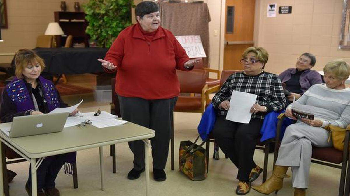 
Georgia Walker (standing) is to take part in a ceremony Jan. 3 in Kansas City to become a Roman Catholic priest. She says it will mean her automatic excommunication. Walker took part in a recent interfaith service at All Souls Unitarian Universalist Church in Kansas City.


