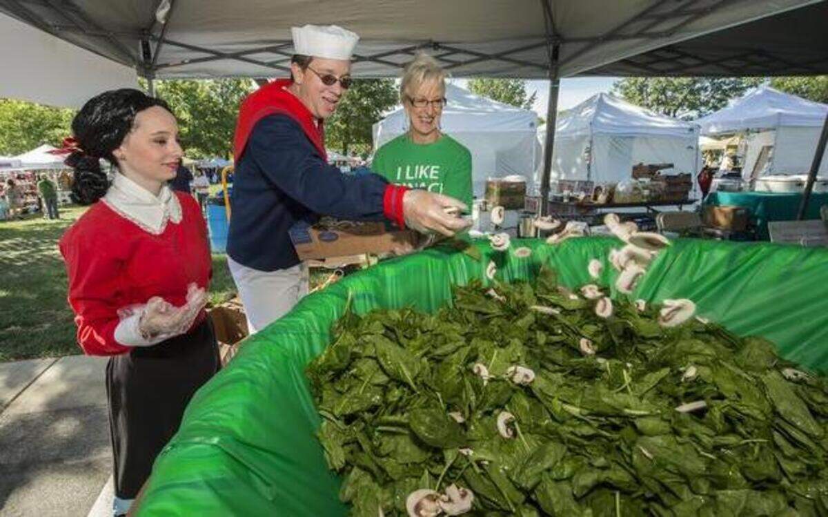 Olive Oyl, portrayed by Emily Robison and Popeye, played by Jeff Benes, helped build a giant spinach salad with Sharon Hammontree of the Lenexa Historical Society at a previous Lenexa Spinach Festival. Proceeds from sales of the giant salad went to fundraising for the Lenexa Historical Society. In the 1930s, Lenexa was hailed as the “Spinach Capital of the World.”