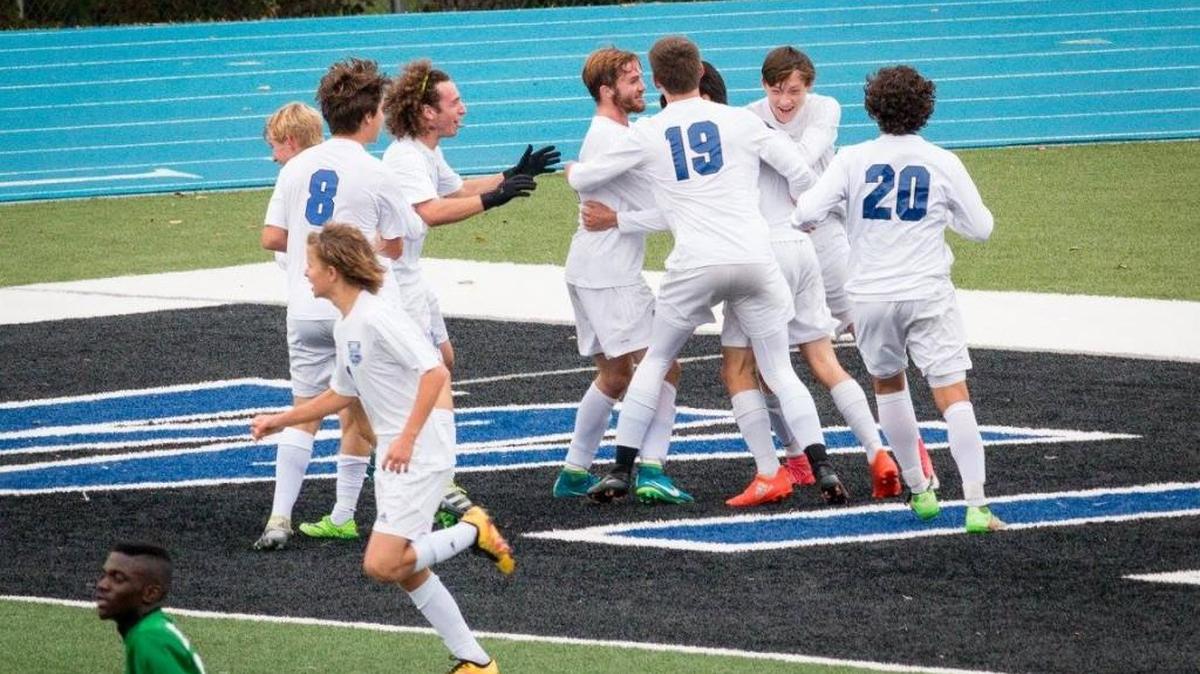 Harrisonville boys soccer team members begin the celebration after beating Kansas City East 2-1 in a Class 3 quarterfinal Nov. 4 at Memorial Stadium. Harrisonville begins its first state-tournament appearance today against Washington.