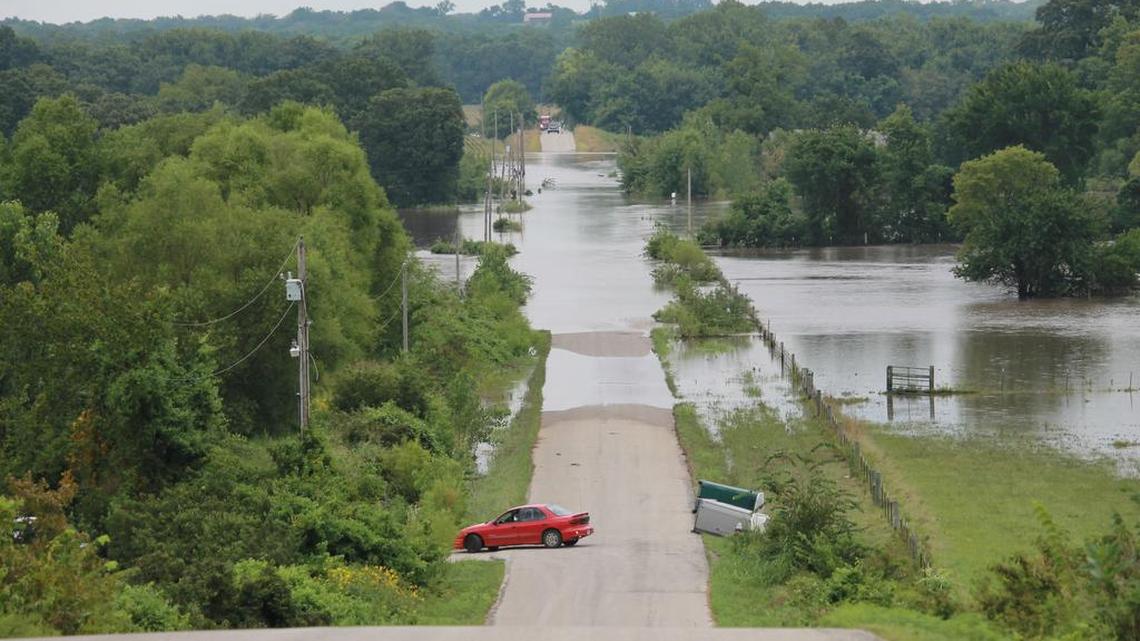 A car driving on Lake Annette Drive in rural Cass County turned around to avoid the flooded road on Thursday, July 27, 2017. The road was one of many covered in water due to the heavy rains that hit the Kansas City region. Due to extensive damage left over from the flash flood, the Cass County commission declared a state of emergency during its meeting on Thursday, Aug. 3, 2017.