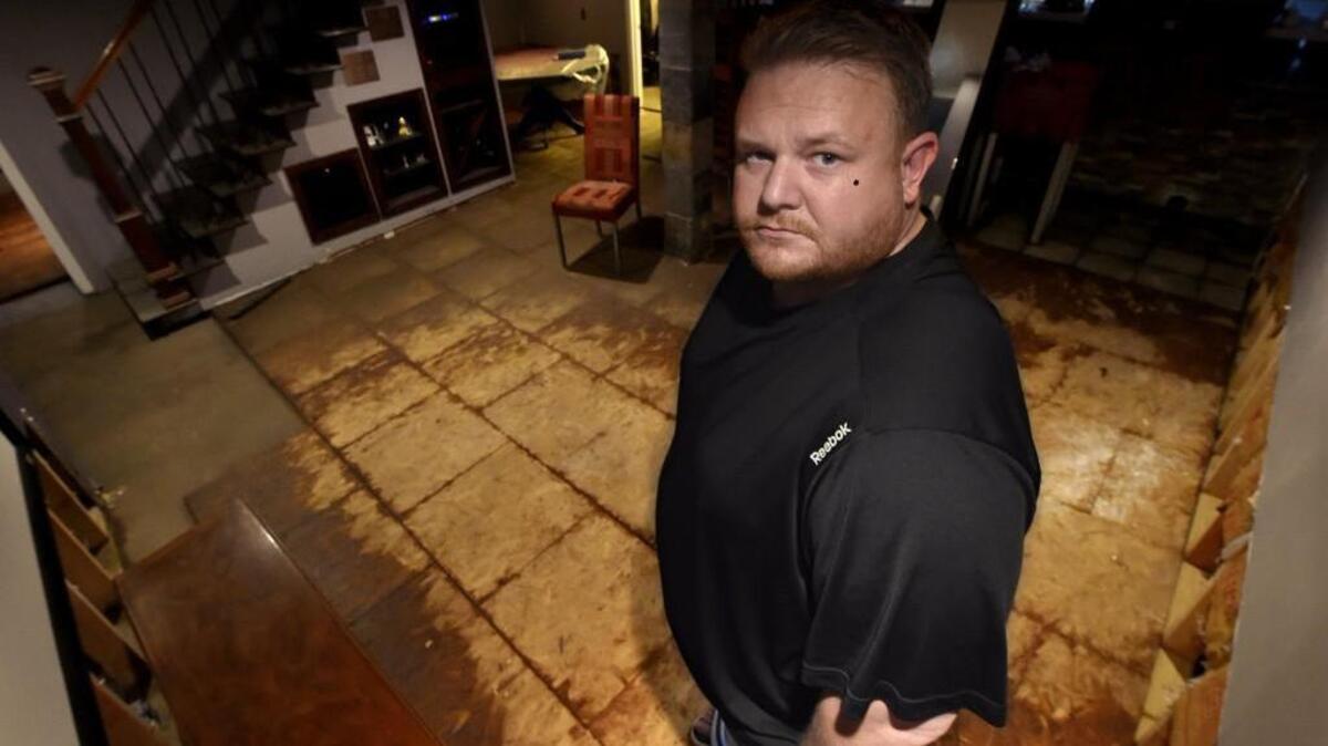 Scott Lanning is one of hundreds of people with a flooded basement after Monday and Tuesday’s epic rains. He and his neighbors say the problem was compounded when city storm runoff backed up into their homes. Now he’s left with a cleanup and rebuild that will cost thousands of dollars.