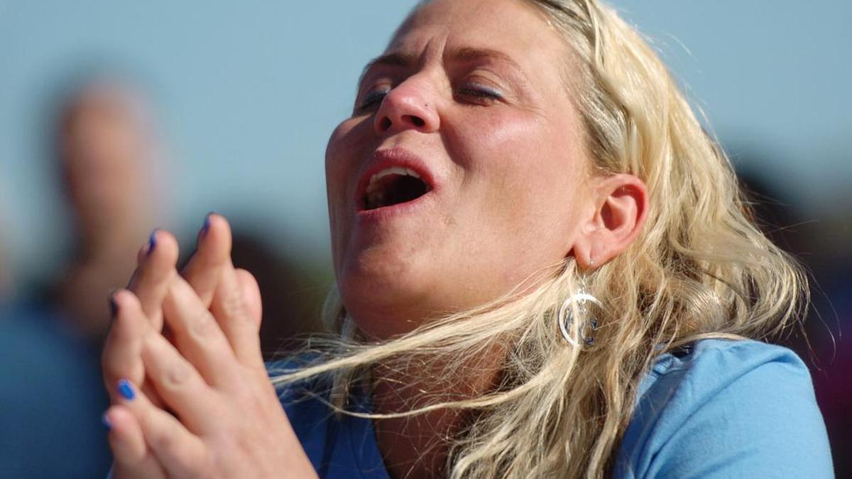 Kayleen Novack of Lenexa reacted to the 2.1 million Scoville Scale Carolina reaper, the hottest in a hot pepper-eating contest last Saturday during the 29th Annual Lenexa Chili Challenge in Old Town Lenexa. Novack and Tommy Stewart of Overland Park fought it out to a tie-breaker before Novack acknowledged defeat.