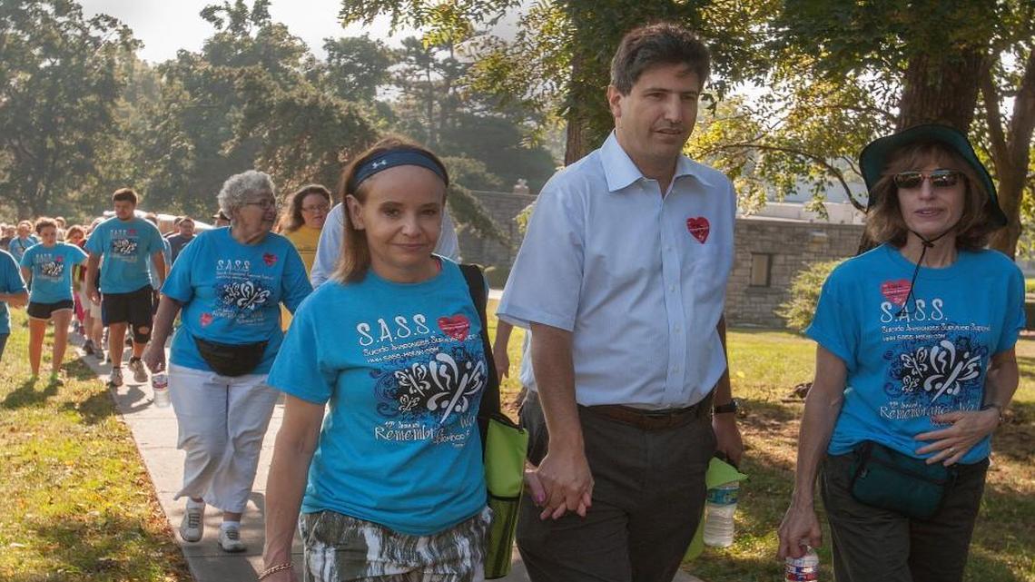
Young Jason Arkin was a bright college student, but his lifelong battle with depression culminated in tragedy last spring. One way his Overland Park family keeps the memory of their son alive is their activism in causes such the Suicide Awareness Survivor Support’s annual Remembrance Walk at Loose Park, held earlier this month. Karen (center) and Steve Arkin (holding hands) joined the walk, which was followed by a ceremonial reading of names and the release of doves. 
