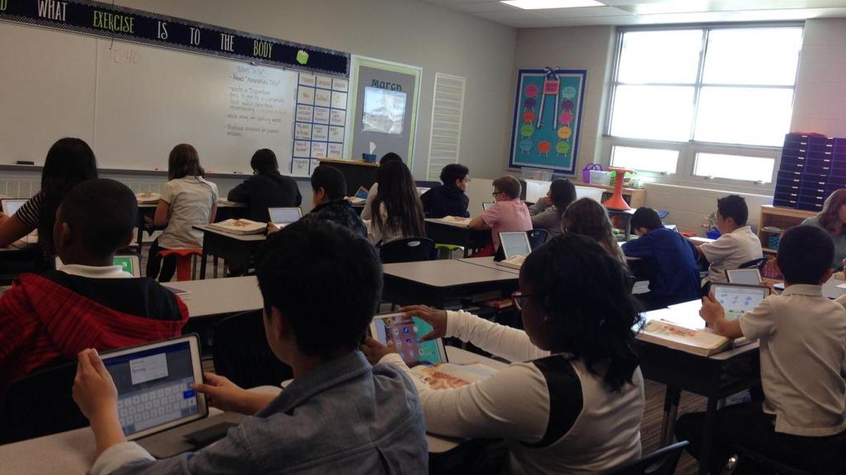 Students get down to business in Audrey Burks’ sixth-grade classroom in the new Shawanoe Elementary School. The first day of school in the new building was March 21.