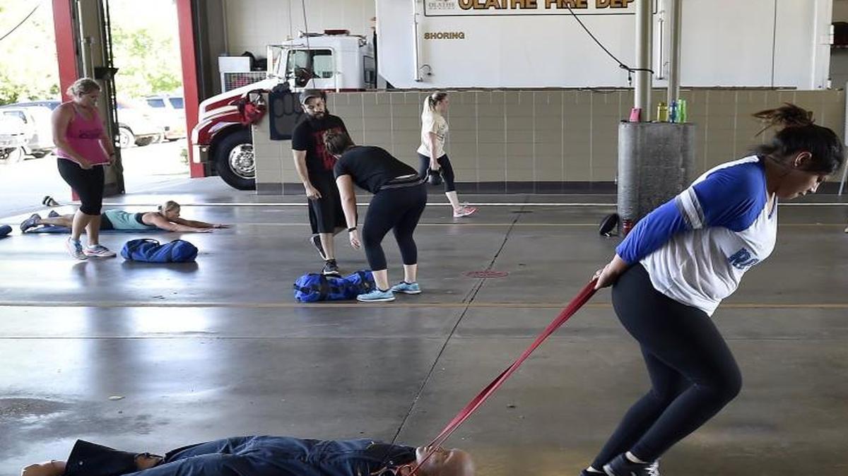 Sam Perez drags a dummy through the fire station at the halfway point of the six-week session June 22.