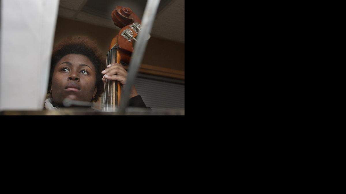 
Bass player Arianna Samuels warmed up in a practice room ahead of a youth jazz festival at the Gem Theater. Many teens said they enjoyed the musical genre. 


