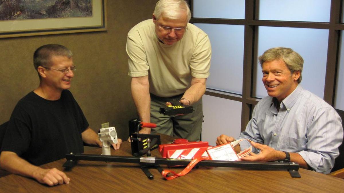 John Martin (from left), Bill Reicheneker and Doug Peavey (right) brainstorm new product ideas on a regular basis for Lenexa-based Peavey Security.