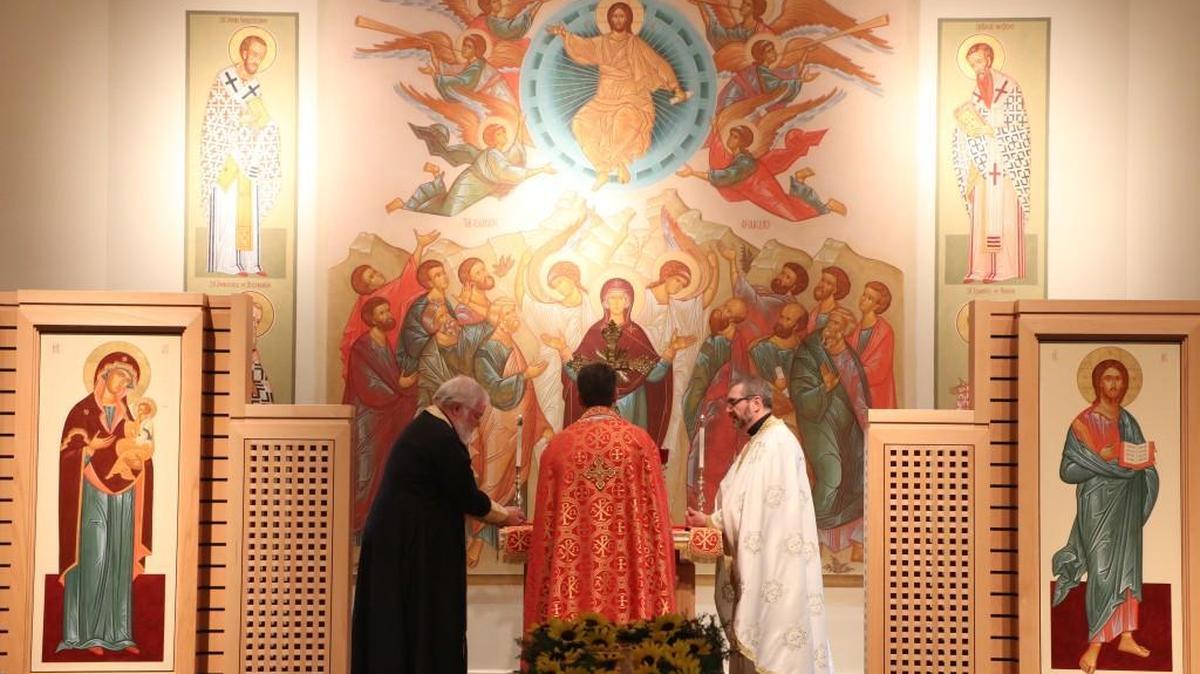 Fathers (from left) Thomas George, Timothy Sawchak, and Michael Medis prepare for Holy Communion on Sunday, Sept. 17, 2017, during the Divine Liturgy at Holy Trinity Orthodox Church in Overland Park.