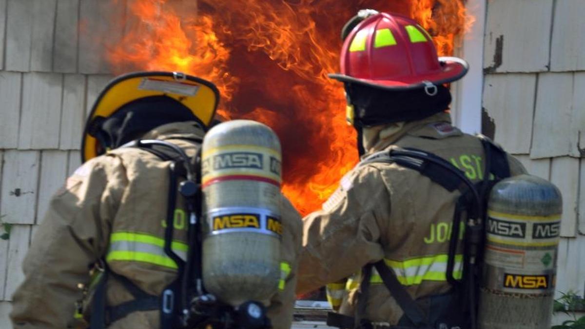 
Johnson County has four county fire districts, mostly covering the more rural parts of the county. One of them is Fire District No. 1, which covers the southwest part of the county. Here District 1 firefighters work to put out a fire at a training house in Edgerton.
