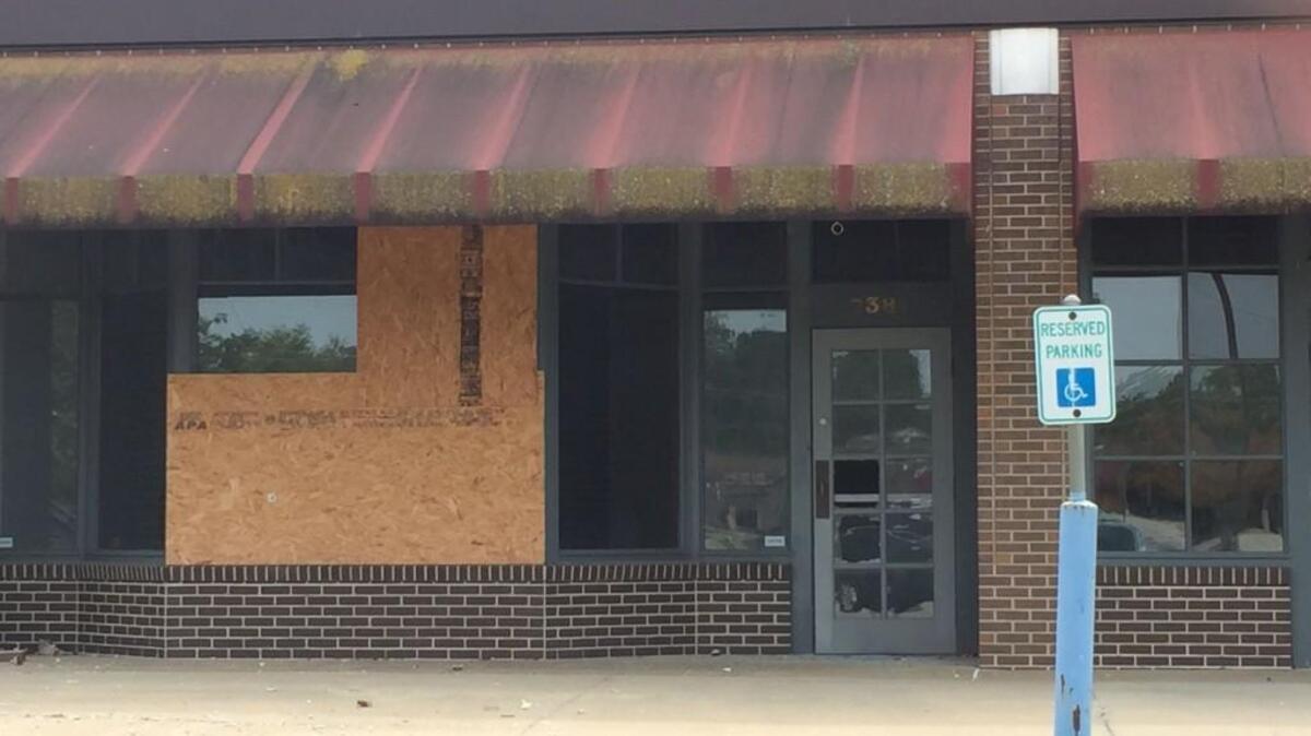 A storefront in Westbrooke Village shows the state of disrepair the center is in.