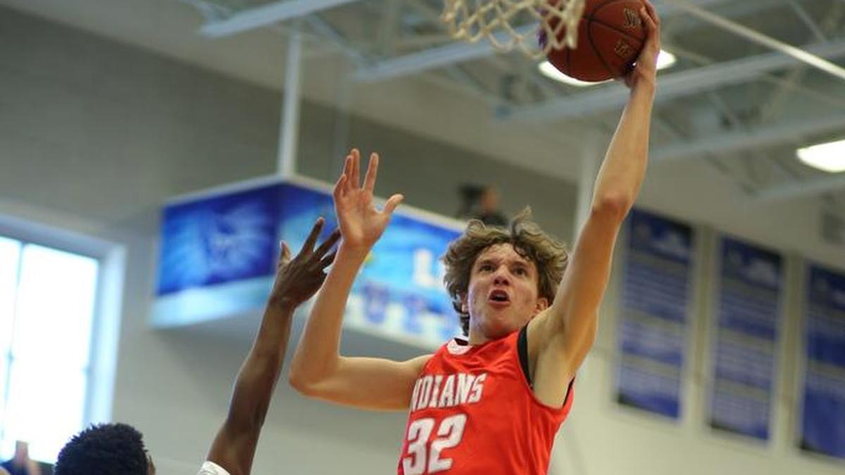 Shawnee Mission North’s Jarrett Hensley drove through the Lee’s Summit defense to the basket Saturday, Dec. 2, 2017, during the 810 Varsity Tipoff Classic at Liberty. Hensley, SM North’s only returning starter, scored a team-high 21 points during an 82-54 loss against the Tigers.