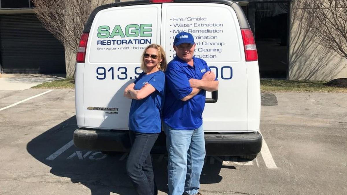 Stephanie and Alan Sage, owners of Sage Restoration, in front of their company van. The couple opened their Overland Park business in 2010.