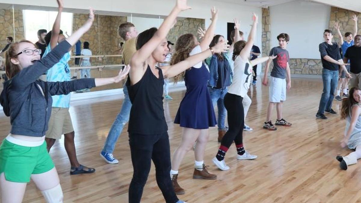 The cast rehearses for “Back to the ’80s,” which continues at Theatre in the Park.