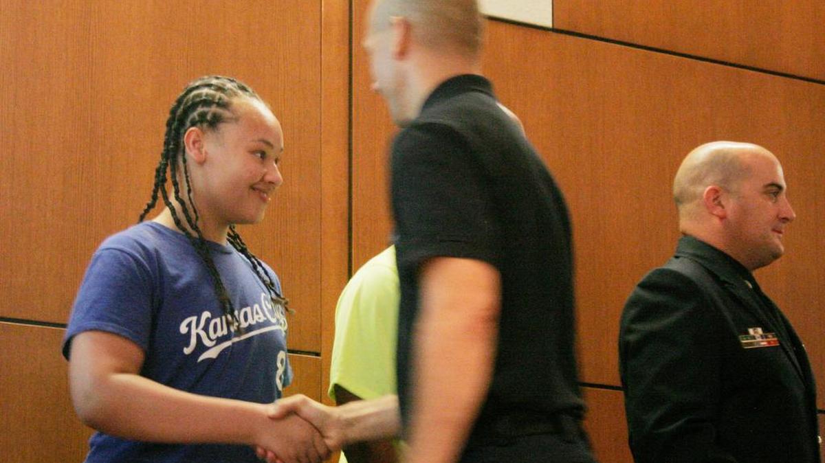 
Gage Banks shakes hands with one of the firefighters who responded to his medical emergency at a cross-country meet last year.

