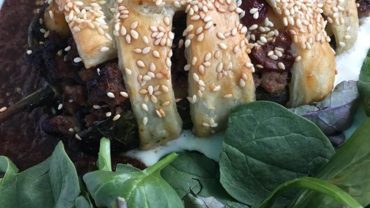 Cacao’s version of the chile relleno wraps a chicken breast stuffed with pork, ground beef and dried nuts in puff pastry and is served with roasted tomato and cheese sauce.