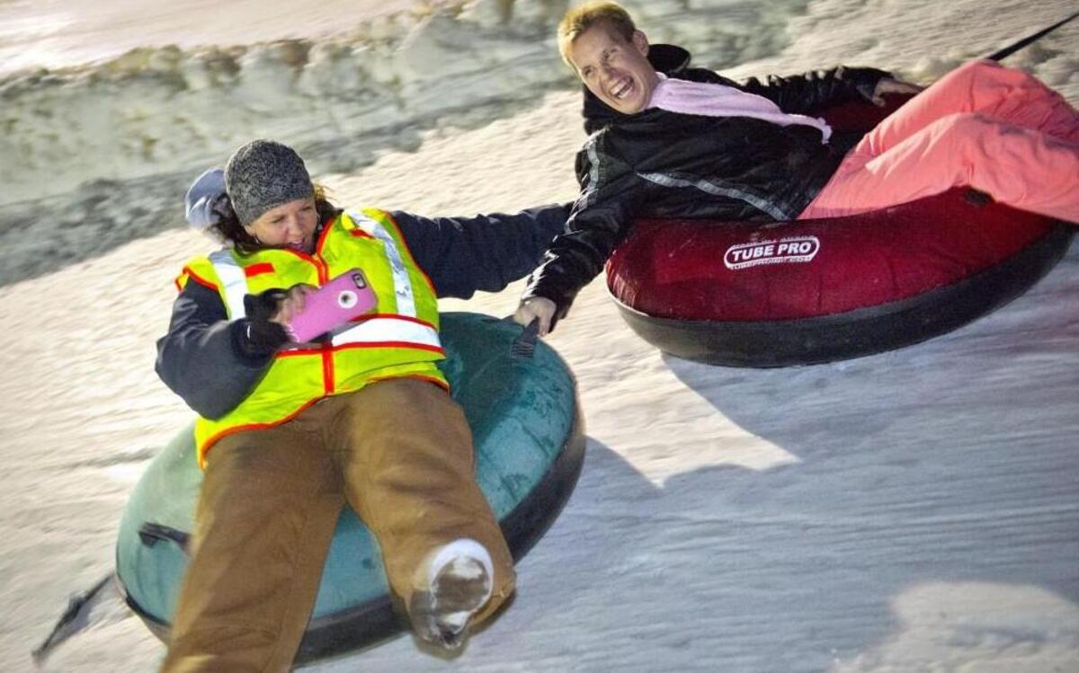 A group called Midwest Adaptive Sports helps people with disabilities enjoy outdoor activities — this time of year, especially skiing. One of the big winter events coordinated by Midwest Adaptive Sports volunteers is a free night of snow tubing at Snow Creek near Weston. At that tubing event, Jaime Johnson (left), care manager for Comfort of Home Healthcare in St. Joseph, got a shot as she zoomed down the slope with Nick Vinyard of Kansas City, North.
