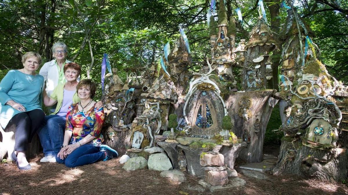 This spring, local artists Joan Sprenger (from left), Andra Chase, Michele Sevcik, all of Overland Park, and Bette Stockdale of Leawood created the Enchanted Castle, a home for gnomes, fairies and trolls at the Enchanted Forest exhibit at the Overland Park Arboretum and Botanical Gardens. The exhibit is on display through Labor Day.