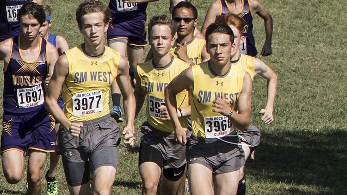 Shawnee Mission West's Logan Klingele, (left) and Conner Austin lead there team out at the start of Crimson Division race at the Rim Rock Classic. SM West finished 22nd out of 46 teams in the race.