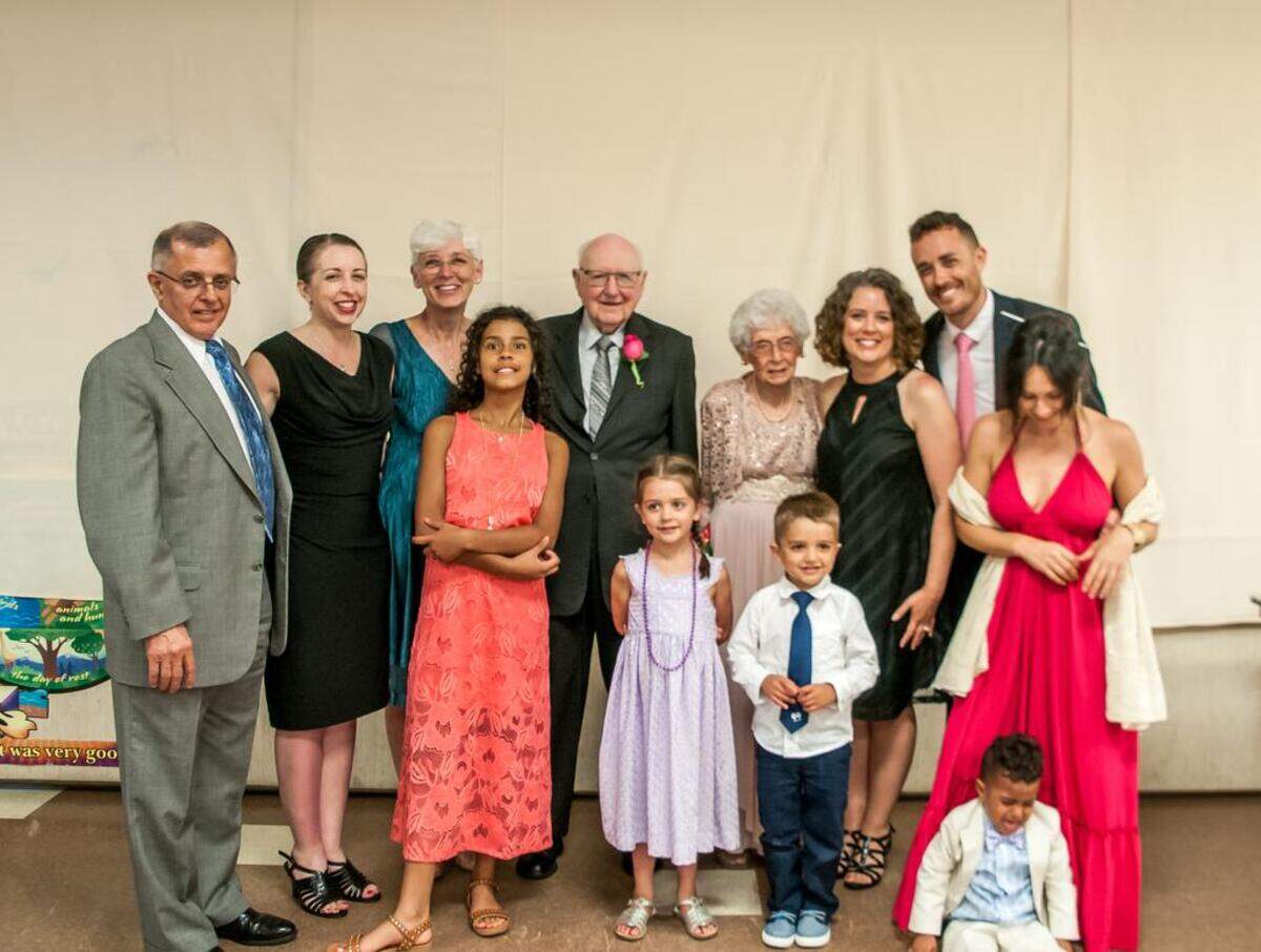 Kenneth and Carolyn Tebow (center) didn’t get to have a wedding reception 75 years ago. But they did get to have one in June, surrounded by their family.