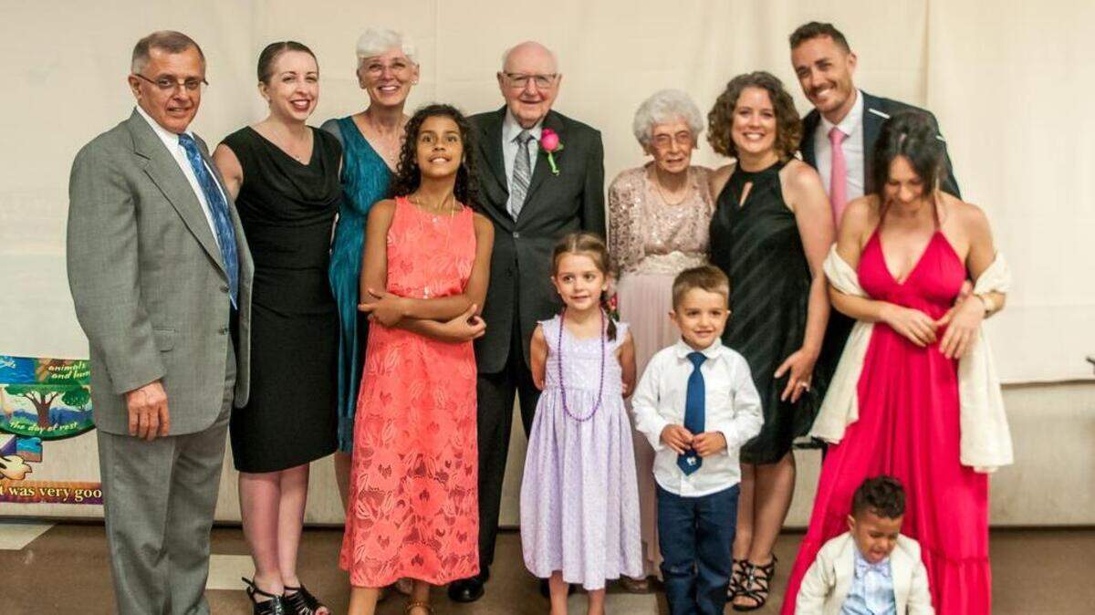 Kenneth and Carolyn Tebow (center) didn’t get to have a wedding reception 75 years ago. But they did get to have one in June, surrounded by their family.