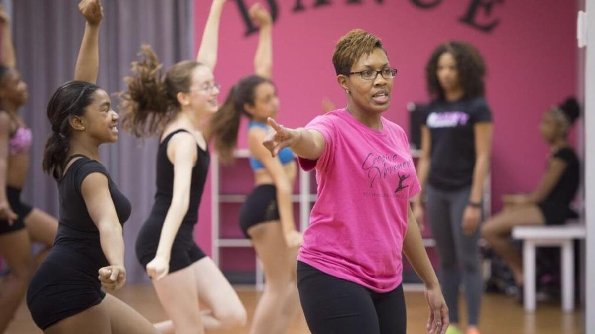 DeShonte' Cobin worked with dance students as they prepared for their performance in Shawnee's Christmas Around Town.