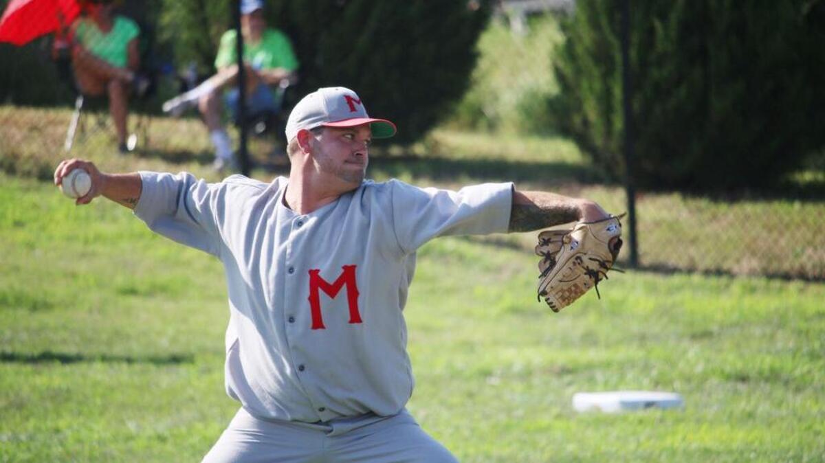 Carl Metz Jr., pitches for the Minneapolis Millers during the game. All the players from both teams were volunteers from the Kansas City Men’s Senior Baseball League.