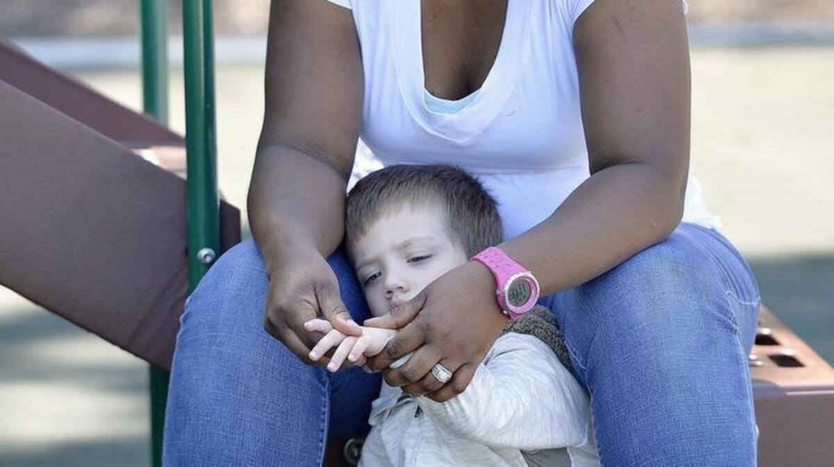 
Head Start marks its 50th year. At Growing Futures Early Education Center on Thursday, lead teacher Keisha Harris looked at 3-year-old Brody Maxwell’s hand that had an insect bite on it.  Growing Futures, in Overland Park, was formerly Head Start of Shawnee Mission.
