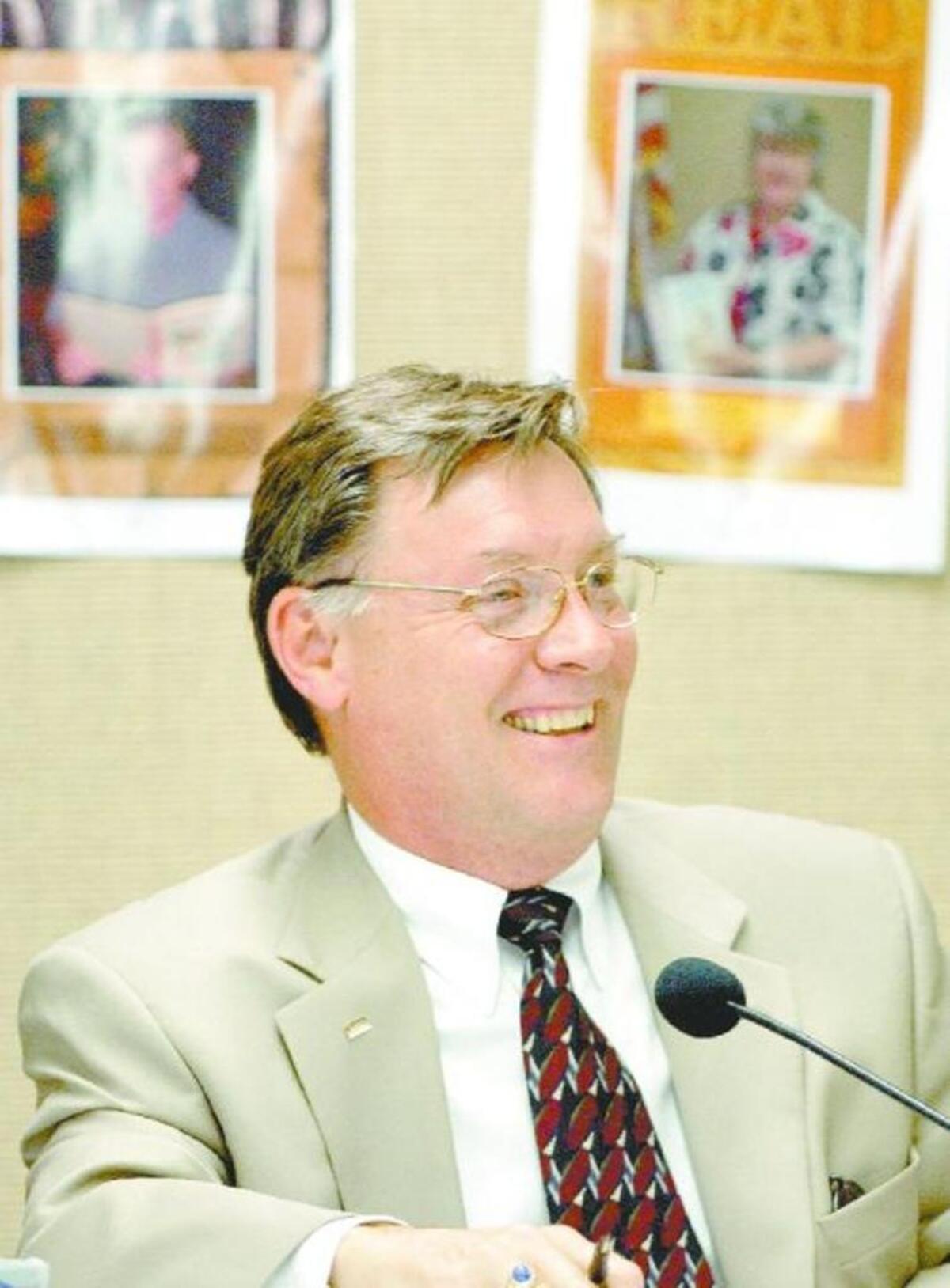 Craig Denny enjoyed a moment at a 2004 Shawnee Mission School Board meeting. Denny is running for his sixth term this year and is on the ballot for an Aug. 1 primary.