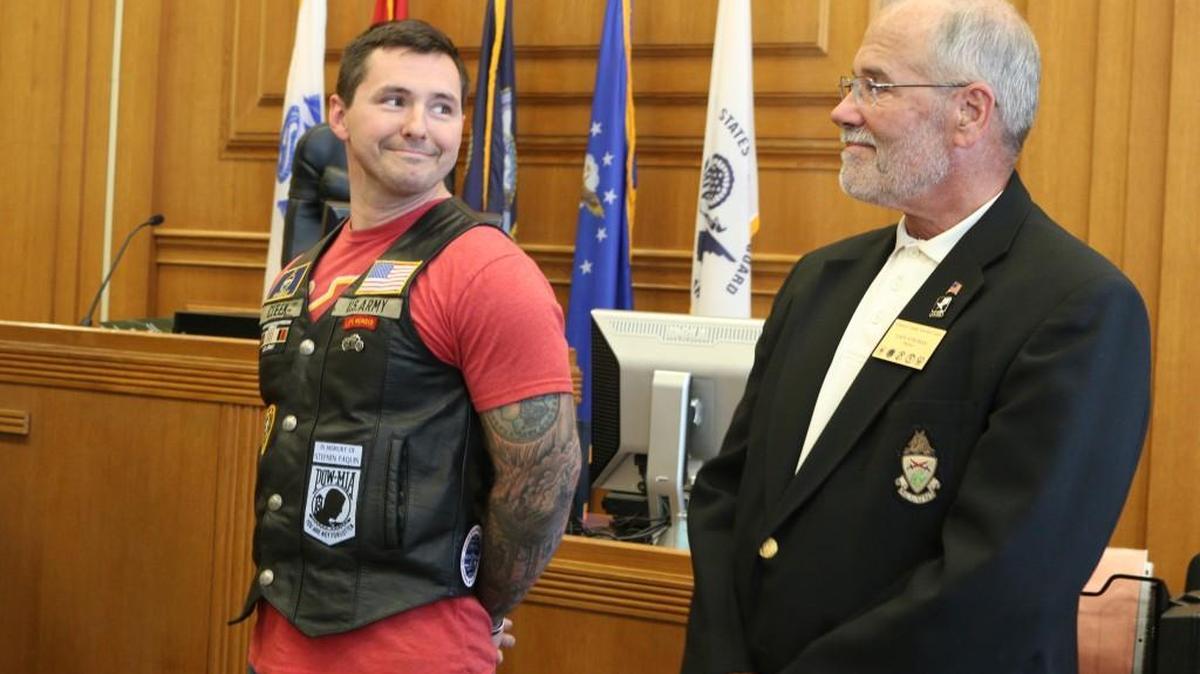 Garrett Cleek of Olathe stood with his mentor, Dave Stroman of Overland Park, during a graduation ceremony for Veterans Treatment Court on Wednesday, Oct. 25, 2017, at the Johnson County District Courthouse.
