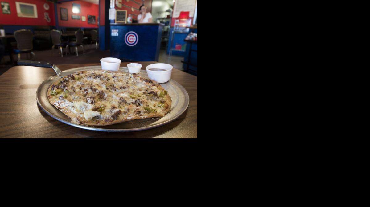 
A hot Italian beef pizza called The Tony is featured at The Pizza Man, 10212 Pflumm Road, Lenexa.It’s a thin crust brushed with oil from the hot giardiniera relish and topped with Italian beef and cheese. 
