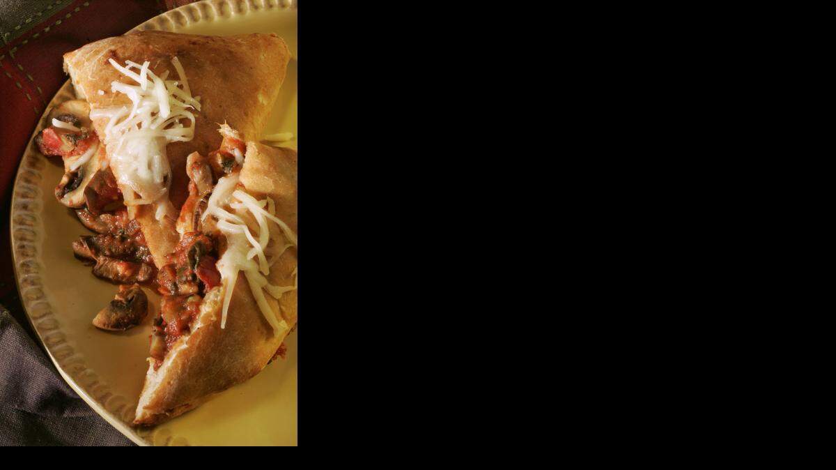 
This recipe for vegetable calzones brings together the ease of refrigerated dough with a healthful serving of mushrooms and spinach in a convenient calzone carrying case.
