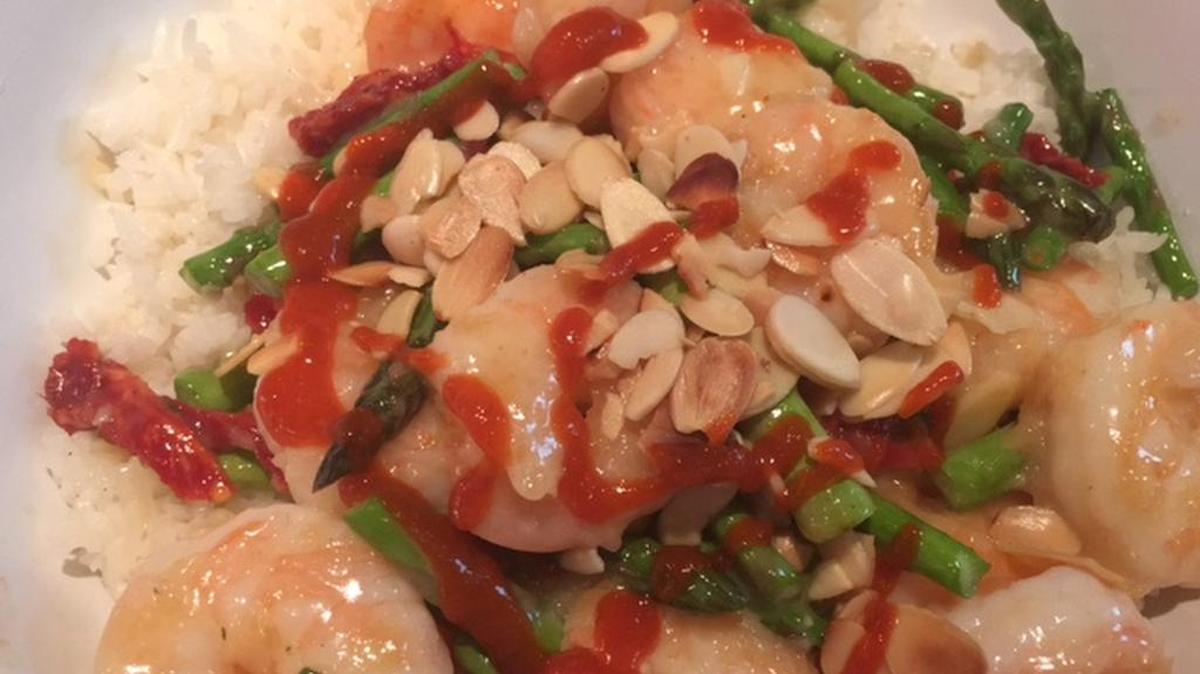 Blue Koi’s Almond Shrimp Asparagus is a popular entrée; swap out the seafood for chicken.