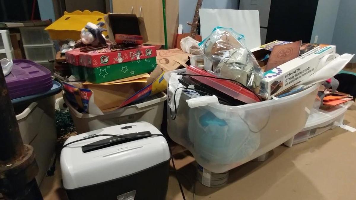 The mountains of stuff ready to be sorted into donation, keep and toss piles.