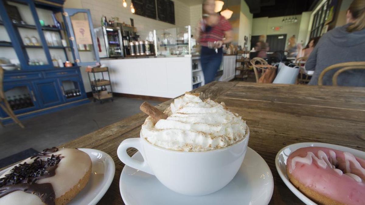 
A pumpkin spice latte can be paired with a chocolate caramel or strawberry doughnut at Pour Coffeehouse, 11120 S. Lone Elm Road, Olathe.

