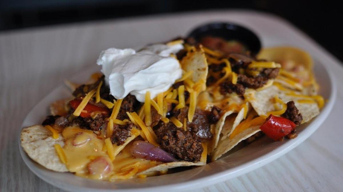 Nacho and burgers are standard fare when a boy is put in charge of dinner out.