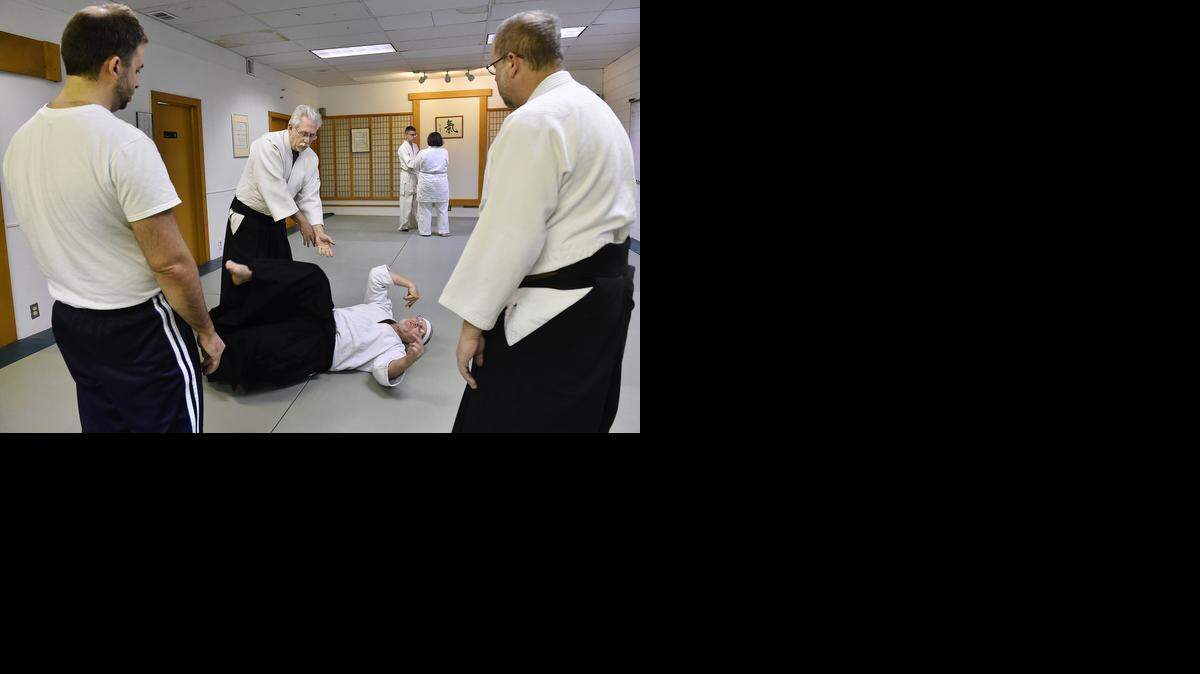 
Members of Midland Ki Society recently practiced aikido techniques at their Merriam dojo. Instructor Vic Montgomery (second left) demonstrates a technique on Tony Pray of Lenexa as Anthony Montaleone of Merriam (left) and Rik Scarborough (right) watch.


