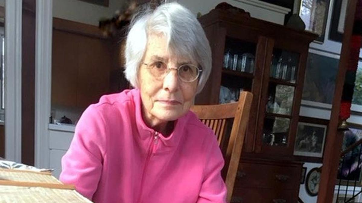 Six months before her death, Lenore Hammer sat for this portrait with the family dogs.