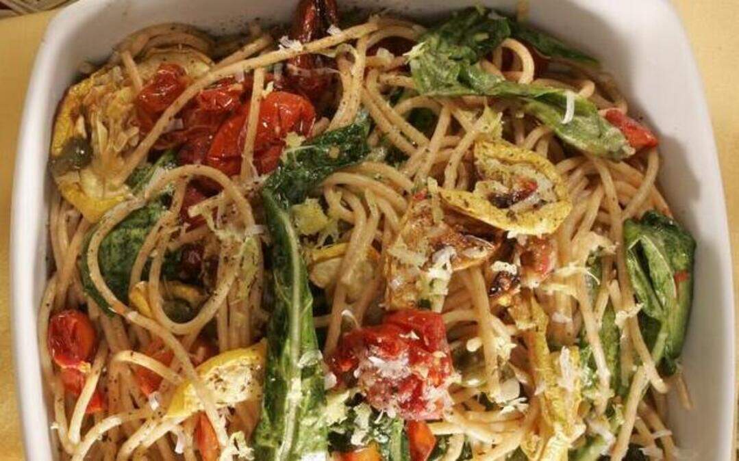 
“Traffic light” spaghetti features arugula, squash, cherry tomatoes and whole wheat pasta.


