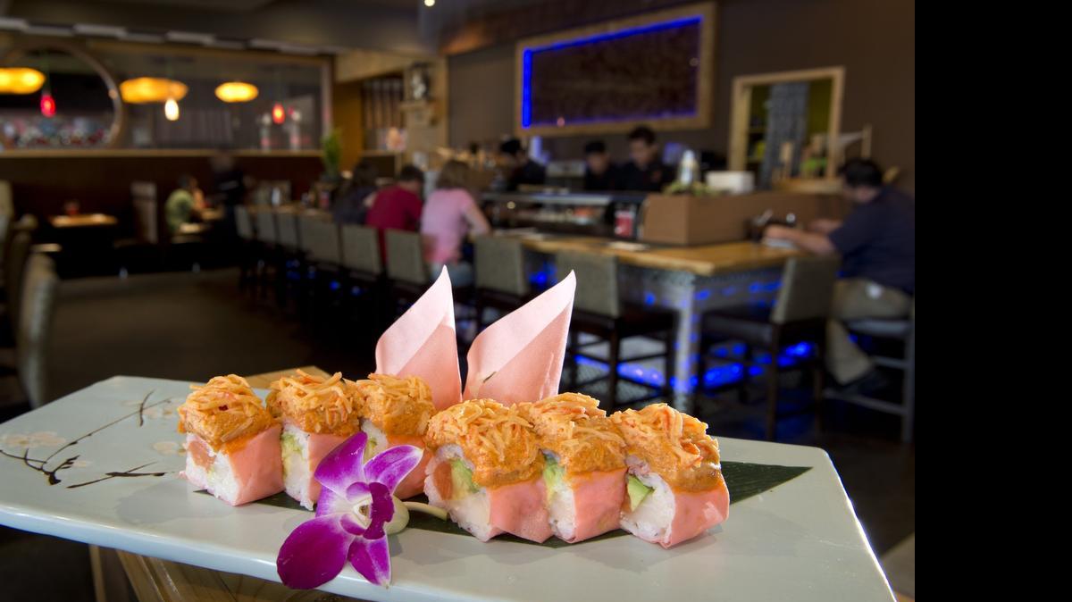 
The Iron Man plate at the Sake Lounge features white tuna, salmon, avocado and caviar in soy paper topped with spicy tuna, spicy crab and spicy mayo.
