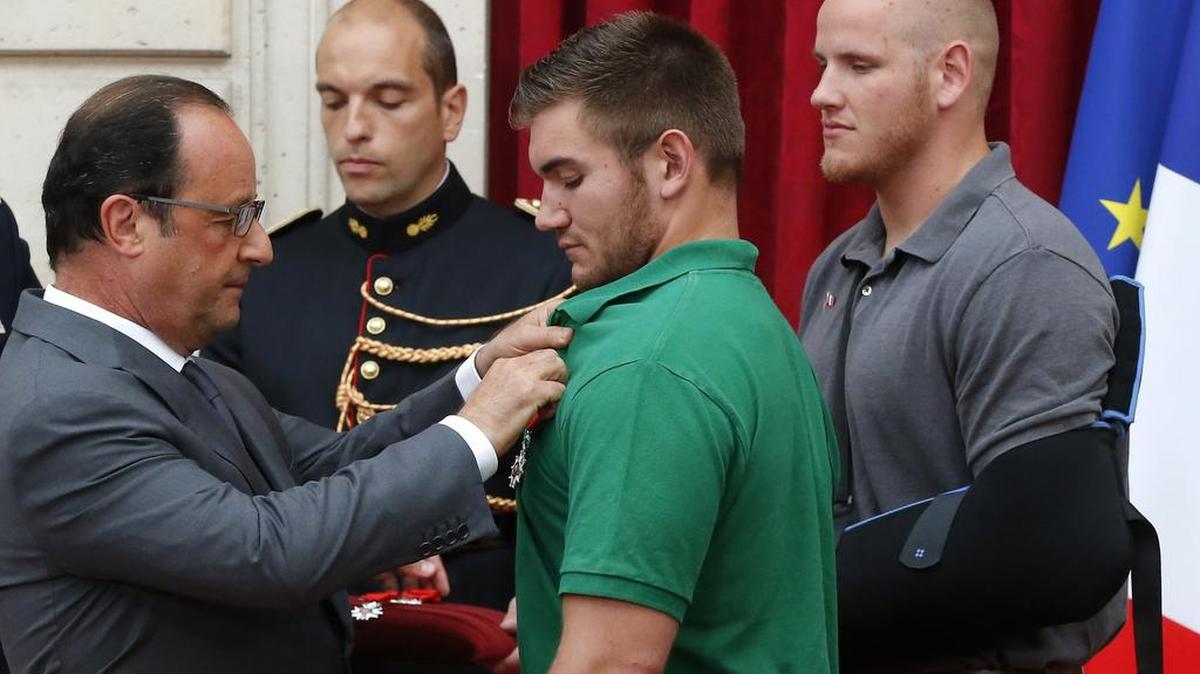 
French President Francois Hollande (left) presented the Legion of Honor to Alek Skarlatos (center), a U.S. National Guardsman from Oregon, U.S. Airman Spencer Stone (right) and Anthony Sadler (not pictured) for their actions in stopping a gunman on a Paris-bound train. 



