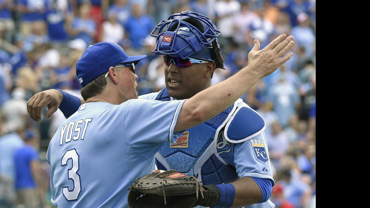 
Kansas City Royals manager Ned Yost and catcher Salvador Perez (13) celebrated Sunday after a victory over the Texas Rangers. 
